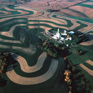 Contour farm with level row patterns around a hill